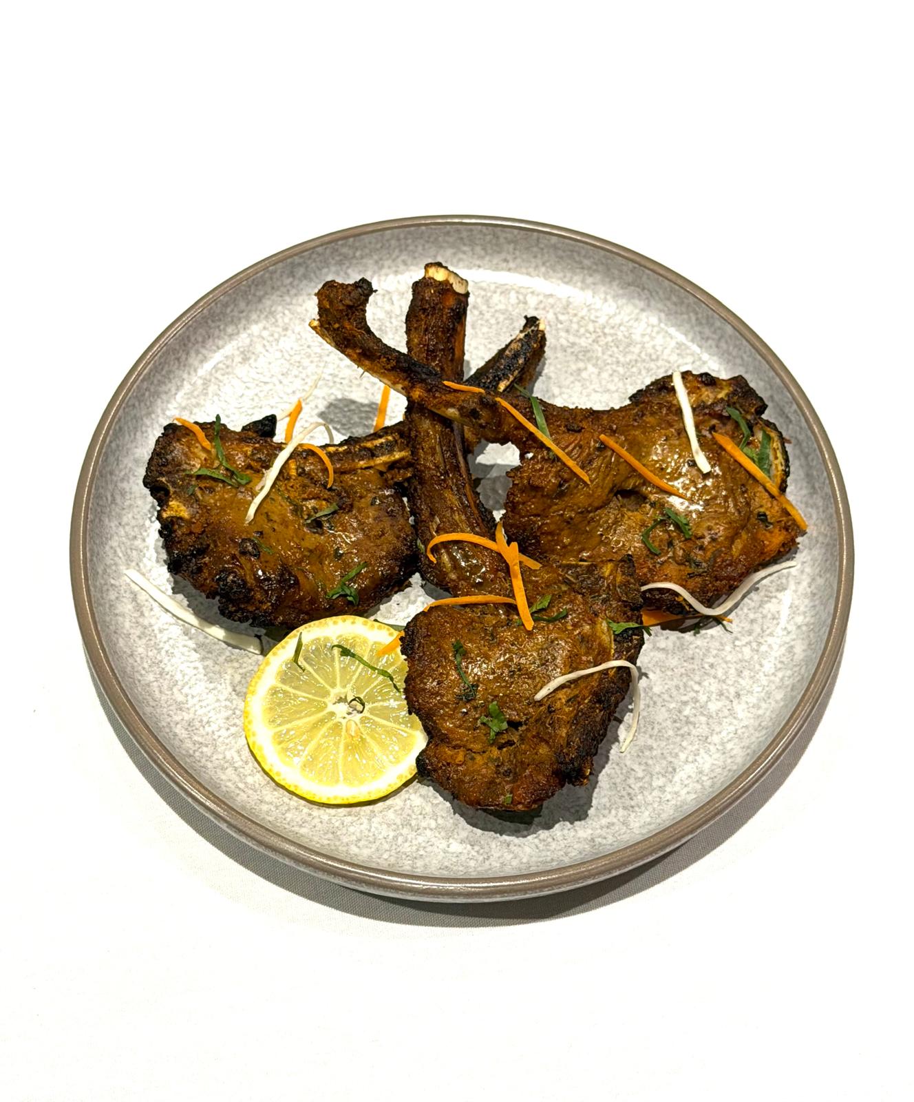 Mixed Indian starters with seekh kebab, chicken tikka, samosa and onion bhaji